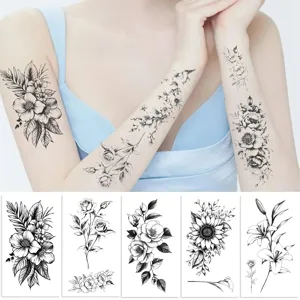 Black floral temporary tattoo stickers, realistic rose and lily body art designs for arm.