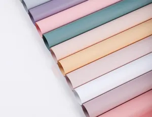 Waterproof floral wrapping paper rolls in various solid colors for Korean flower bouquets.