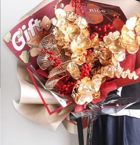 Waterproof floral wrapping paper detail, elegant gold flower bouquet wrap design and print.