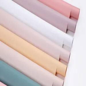 Waterproof floral wrapping paper rolls in pastel colors, ideal for romantic rose bouquets.