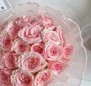 Korean style pink rose bouquet wrapped in pleated pearl mesh lace for romantic floral design.