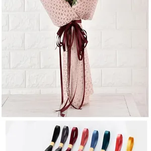 1cm wide solid color ribbon detail shot showing floral wrapping and various color options.