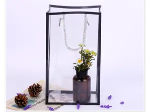 Transparent PVC flower gift bag with black border and handles for bouquet packaging.