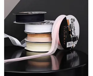 Detailed view of 2.6cm chiffon ribbon rolls in assorted pastel and dark colors for gift wrapping.