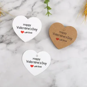 Heart-shaped paper gift tags with Valentine's Day print for wedding party decoration.