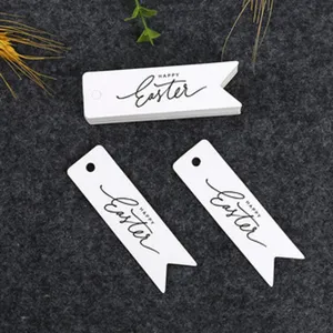 White paper gift tags with Easter print, blank hanging labels for holiday decoration crafts.
