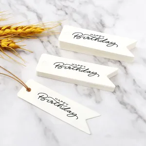 White paper happy birthday hang tags with gold string for gift decoration and party wrap.