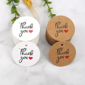 Round paper gift tags with thank you print, white and kraft color for packaging decoration.