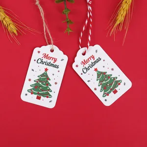 Christmas paper gift tags featuring tree pattern and strings for holiday party decoration.