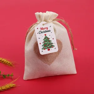 Christmas linen gift bag with heart patch and Merry Christmas hang tag for holiday party favors.