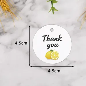 Close-up detail of the round lemon gift hanging tag with gratitude text and 4.5cm size.