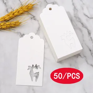 White paper gift tags with hollow reindeer design, pack of fifty pieces detail view.