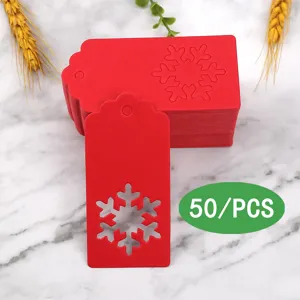 Red Christmas paper gift tags with snowflake cutouts, pack of 50 for holiday party decor.