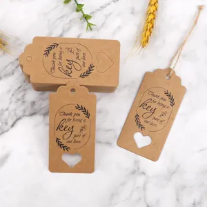 Kraft paper gift tags with heart hollow design, printed thank you text, perfect for party favors.