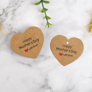 Detail shot of heart-shaped kraft paper gift tags with Mother's Day print and love text.