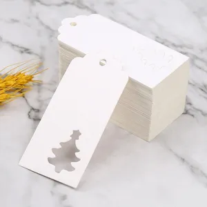 White Christmas paper tags with hollow tree design, gift hanging tags for holiday.