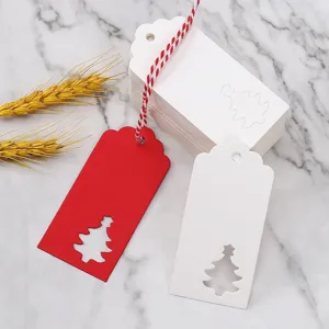 Christmas gift tags with hollow tree design, white and red paper cards for holidays.