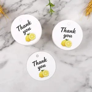 Round paper gift tags with lemon illustration and thank you text for packaging decoration.