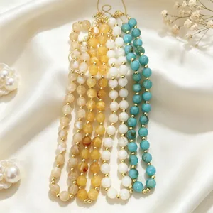 Colorful acrylic beaded necklace detail view, showcasing vibrant multi-color beads on satin.