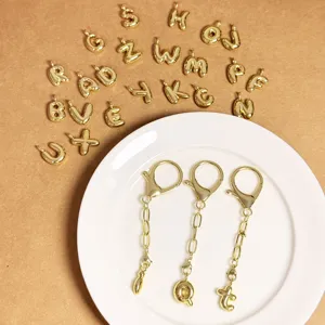 Gold-plated 3D bubble letter keychain and pendant set, perfect for personalized bags.