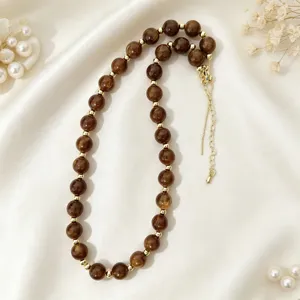 Brown acrylic beaded necklace with gold spacers, elegant choker for women daily wear.