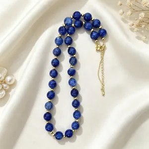 Detailed close-up view of the stylish blue beaded necklace highlighting delicate gold spacers.