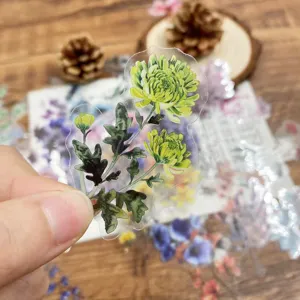 Close-up view of transparent PET floral sticker featuring detailed green chrysanthemum illustration.