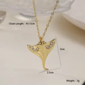 Gold-plated stingray pendant necklace with sparkling cubic zirconia, elegant detail shot.