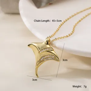 Gold-plated manta ray pendant necklace close-up, sparkling zircon stones, delicate chain detail.