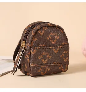 Mini portamonete zainetto con motivo monogram marrone, borsa chiavi creativa e ciondolo.