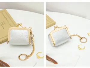 Mini PU leather kiss lock coin purse detail view, compact jewelry pouch for rings and coins.