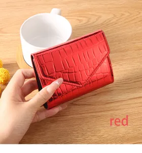 Red crocodile pattern PU leather wallet detail view showing texture and compact folding design.