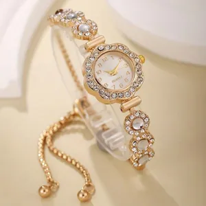 Detailed view of elegant gold women's quartz bracelet watch with rhinestone flower bezel