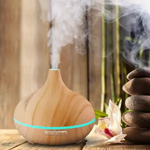 Wood grain onion essential oil diffuser emitting fine mist with ambient blue light