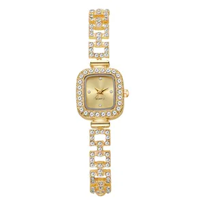 Detailed shot of an elegant gold square bracelet watch with rhinestone accents