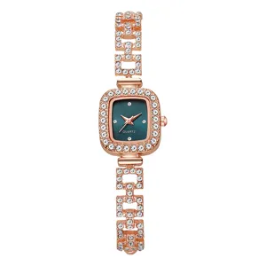 Detailed view of an elegant rose gold square women watch encrusted with shiny rhinestones