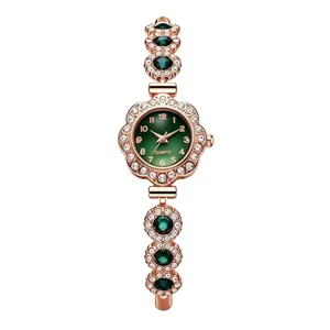 Detailed macro view of luxury women's green dial quartz bracelet watch with sparkling rhinestones