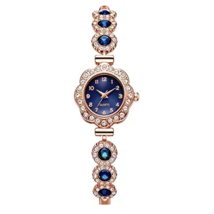 Detailed view of women's quartz bracelet watch with blue dial and crystals