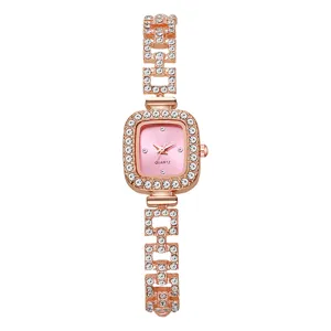 Detailed view of rose gold square ladies watch with rhinestone bracelet band