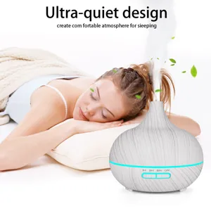 Wood grain aroma diffuser humidifier next to sleeping person