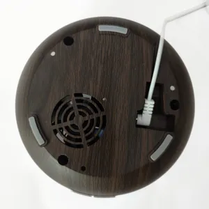Detailed bottom view of dark wood grain humidifier showing power port and air vents