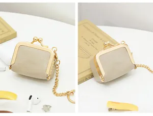 Mini PU leather kiss lock coin purse detail view, cute retro jewelry storage pouch.