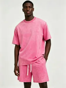 Detailed view of the vintage washed pink short sleeve t-shirt and shorts set with drawstrings.