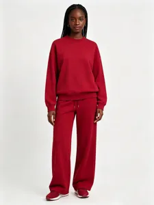 Solid red crewneck sweatshirt and wide leg sweatpants matching casual tracksuit for women.