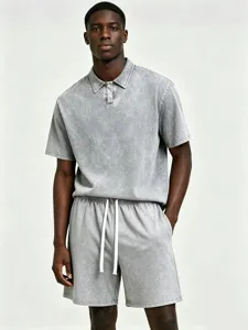 Detailed view of men's vintage mineral wash grey short sleeve polo shirt and shorts set.