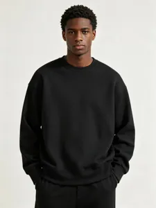 Detailed shot of a black heavyweight crewneck sweatshirt for men, cozy casual solid wear.