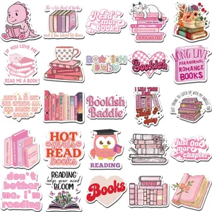 Close-up details of aesthetic pink bookish stickers featuring reader quotes and cute designs.