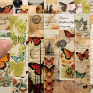 Close-up detail view of vintage green butterfly bookmark featuring botanical grape leaf design.