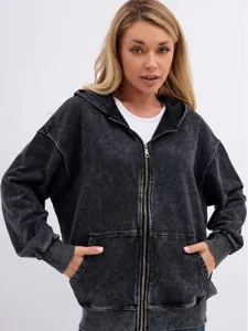 Close-up view of the vintage acid-washed zip-up hoodie showing texture and metal zipper details.
