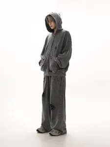 Distressed grey washed cotton hoodie and matching sweatpants set detail, streetwear style.